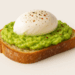 Sourdough toast topped with mashed avocado, poached egg, and chili flakes.