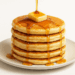 Stack of fluffy buttermilk pancakes with butter